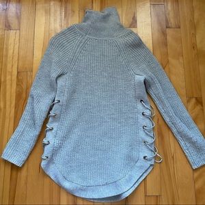 Grey Knit Turtleneck sweater with criss cross detail on the sides